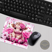 Pink Highland cow mouse pad with floral accents. Sublimated, non-slip backing. Personalized name option available, making it uniquely yours
